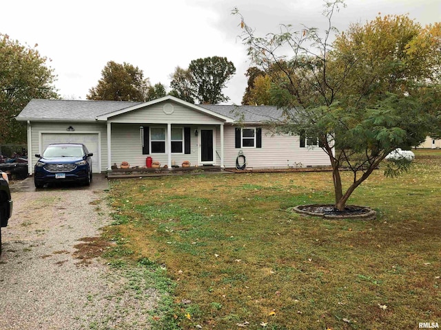 ranch-style home featuring a front lawn and a garage