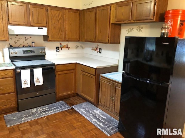 kitchen with black appliances and dark parquet flooring