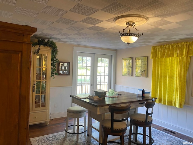 dining space with french doors and dark hardwood / wood-style flooring