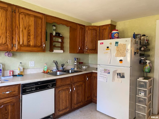 kitchen featuring sink and white appliances