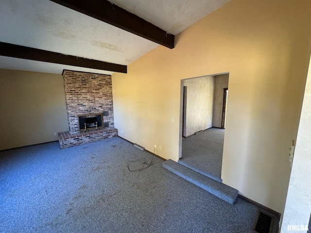 unfurnished living room featuring vaulted ceiling with beams, carpet, a textured ceiling, and a brick fireplace