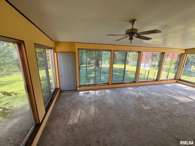 unfurnished sunroom featuring ceiling fan and lofted ceiling