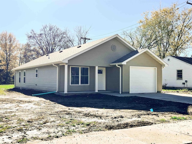 ranch-style home featuring a garage