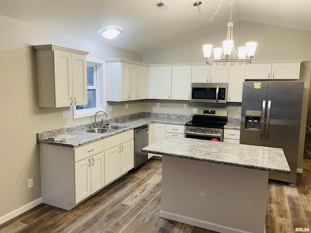 kitchen with dark wood-style floors, appliances with stainless steel finishes, a sink, and visible vents