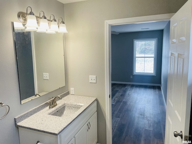 bathroom featuring vanity and wood-type flooring