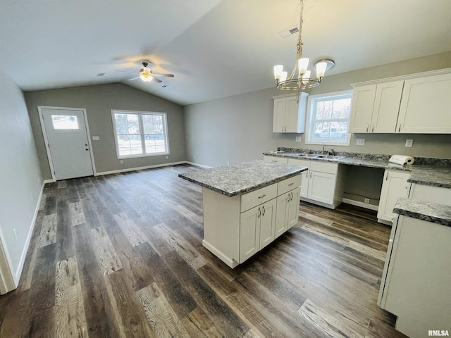 kitchen featuring plenty of natural light, dark hardwood / wood-style floors, and white cabinetry