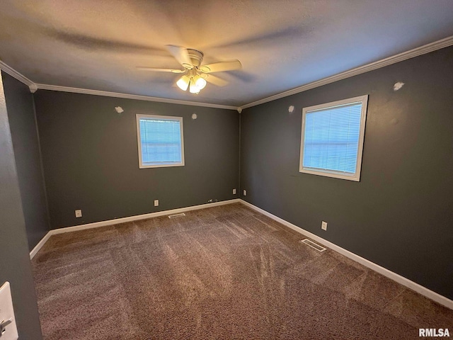 spare room with carpet, ceiling fan, and crown molding