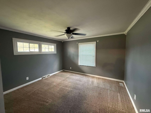 carpeted spare room featuring ornamental molding and ceiling fan