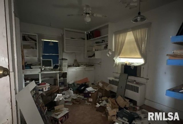 kitchen with ceiling fan and radiator heating unit