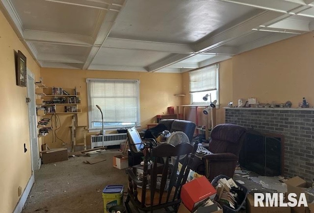 misc room featuring coffered ceiling, radiator heating unit, a brick fireplace, and beam ceiling