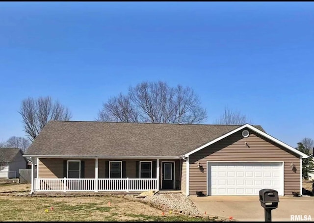 single story home with covered porch and a garage