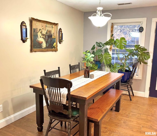 dining room with light hardwood / wood-style flooring