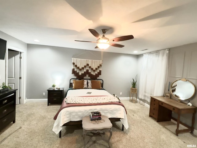 bedroom featuring ceiling fan and carpet