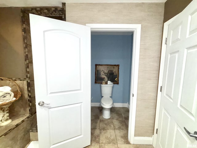 bathroom featuring tile patterned floors and toilet