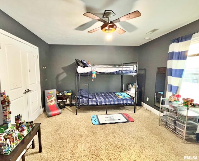 carpeted bedroom featuring ceiling fan