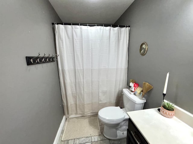 bathroom with tile patterned flooring, vanity, toilet, and a shower with shower curtain