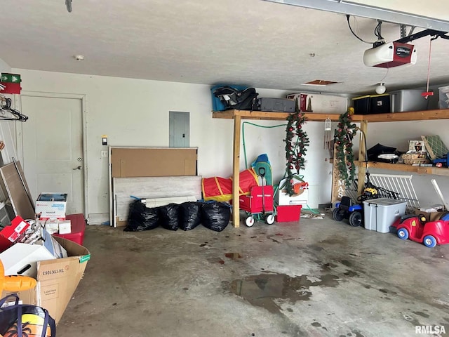 garage with electric panel and a garage door opener