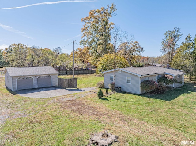 view of yard with a garage and an outdoor structure