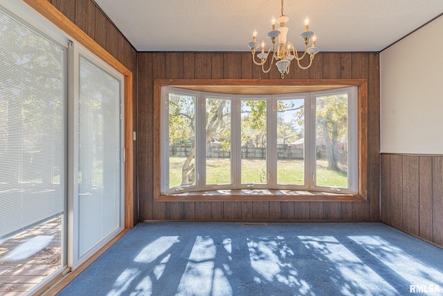 unfurnished sunroom with a chandelier