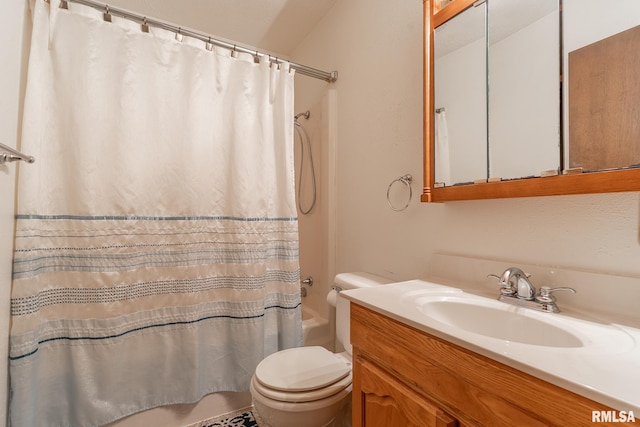 full bathroom featuring toilet, vanity, and shower / bath combo with shower curtain