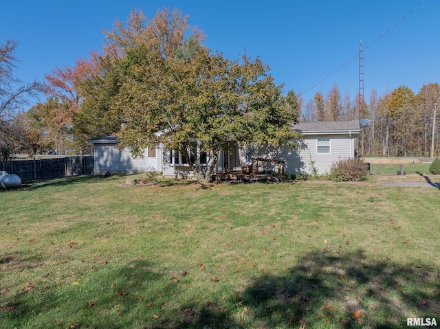 rear view of house with a lawn