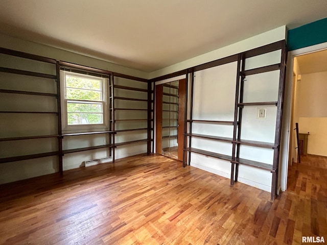 interior space with a closet and hardwood / wood-style flooring