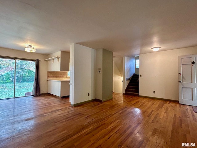 unfurnished living room with hardwood / wood-style flooring