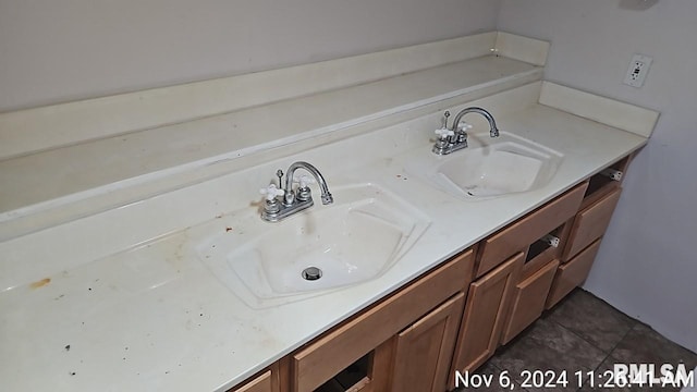 bathroom featuring tile patterned flooring and vanity