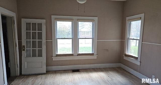 doorway to outside with light hardwood / wood-style floors