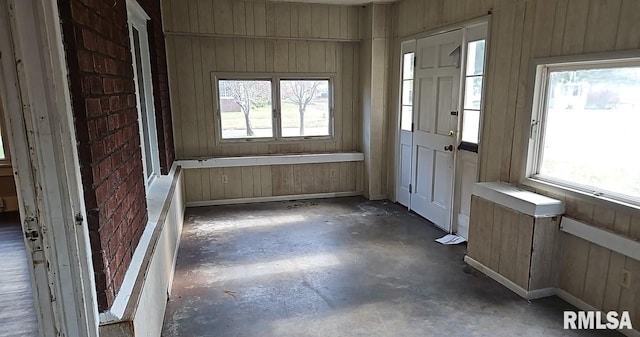 interior space featuring wood walls