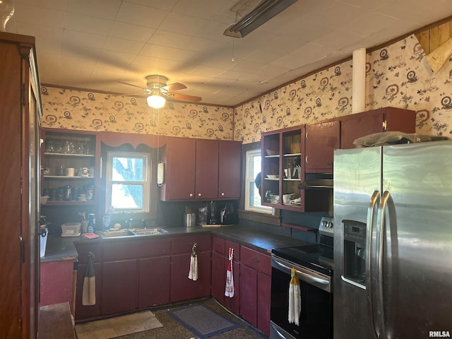 kitchen featuring ventilation hood, ceiling fan, sink, and appliances with stainless steel finishes