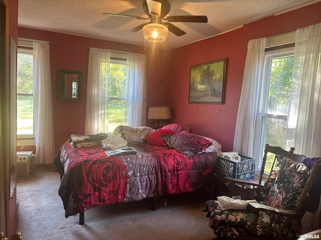 bedroom with multiple windows and ceiling fan