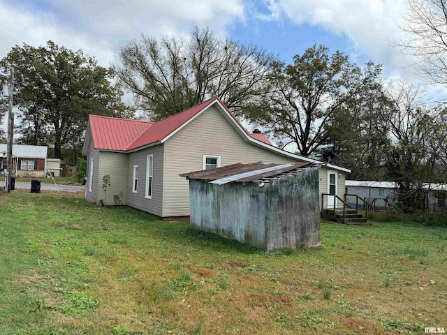 view of side of home featuring a yard