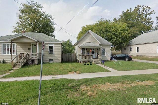 bungalow featuring a porch and a front yard