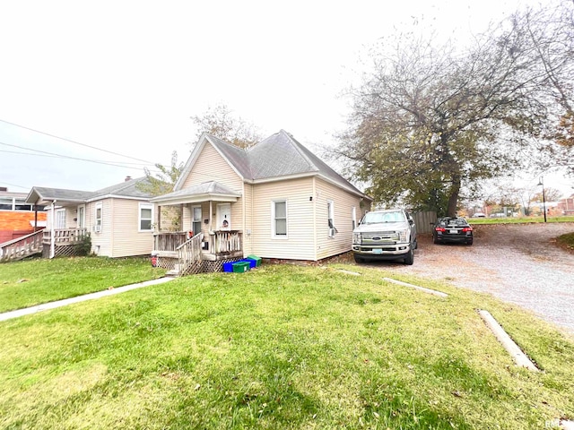 bungalow featuring a front yard