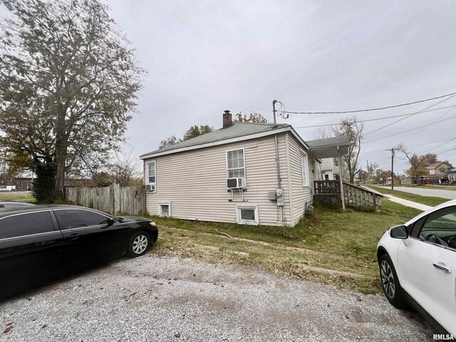 416 S Washington St, Carbondale, IL 62901 - view of side of home featuring a chimney and cooling unit