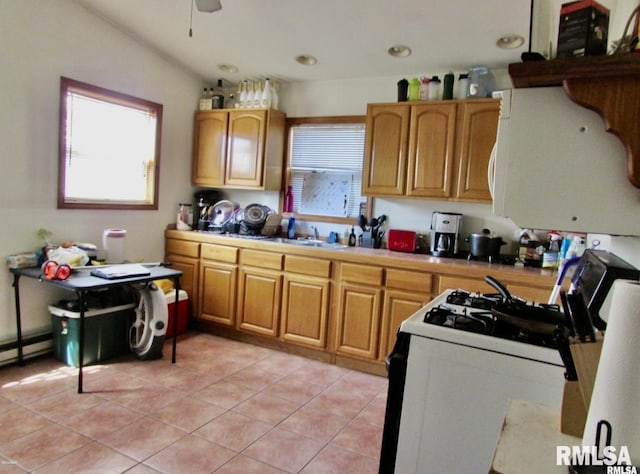 416 S Washington St, Carbondale, IL 62901 - kitchen featuring white appliances, light tile patterned flooring, light countertops, ceiling fan, and a sink