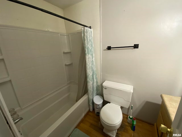 full bathroom featuring wood-type flooring, vanity, shower / bath combo, and toilet