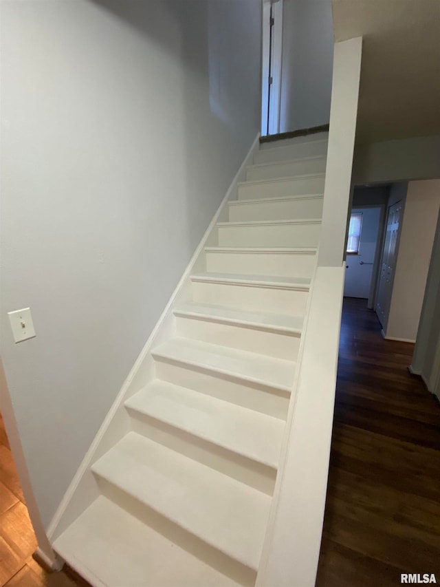 stairway featuring hardwood / wood-style flooring