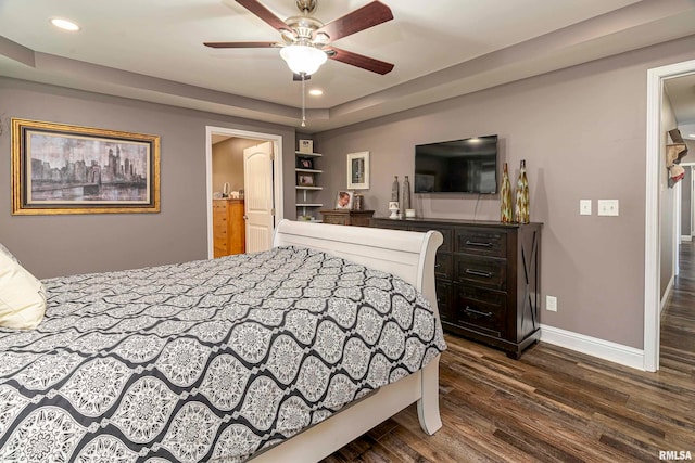 bedroom featuring ceiling fan and dark hardwood / wood-style floors