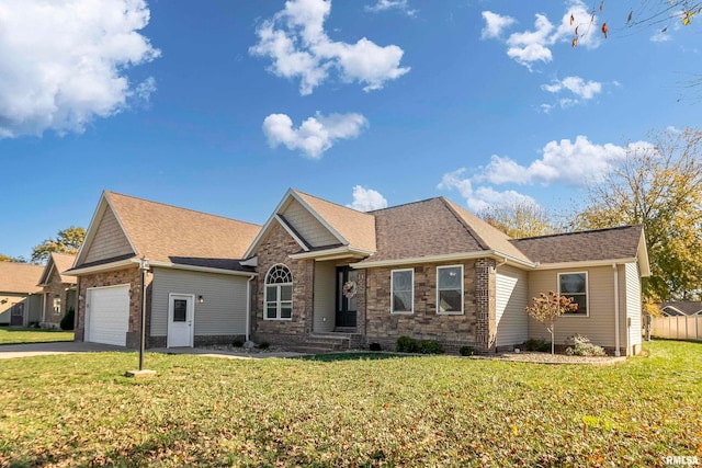 view of front facade featuring a front yard and a garage