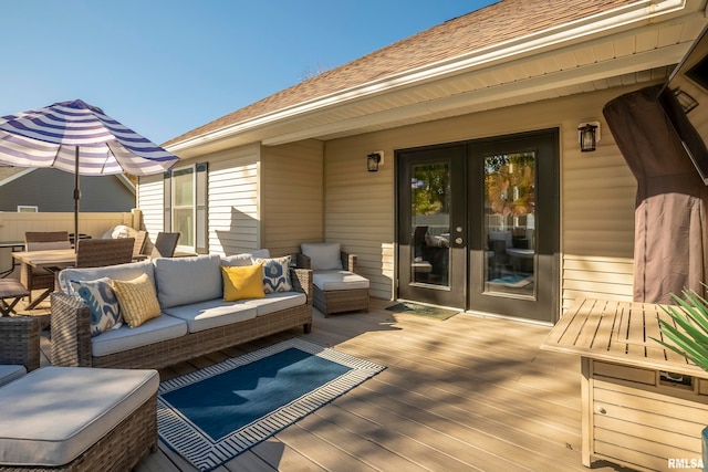 wooden terrace with outdoor lounge area