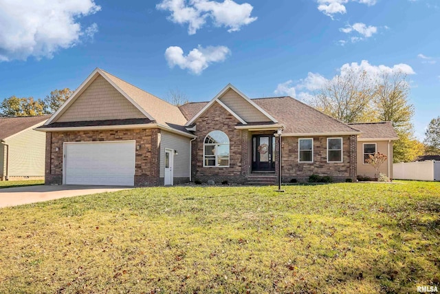 view of front of home featuring a front yard and a garage