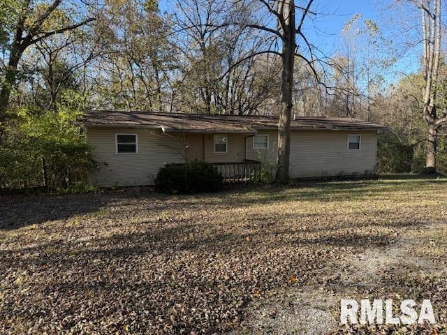 rear view of property with a deck