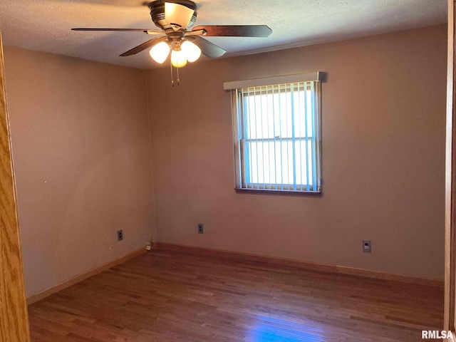 unfurnished room with hardwood / wood-style flooring, ceiling fan, and a textured ceiling