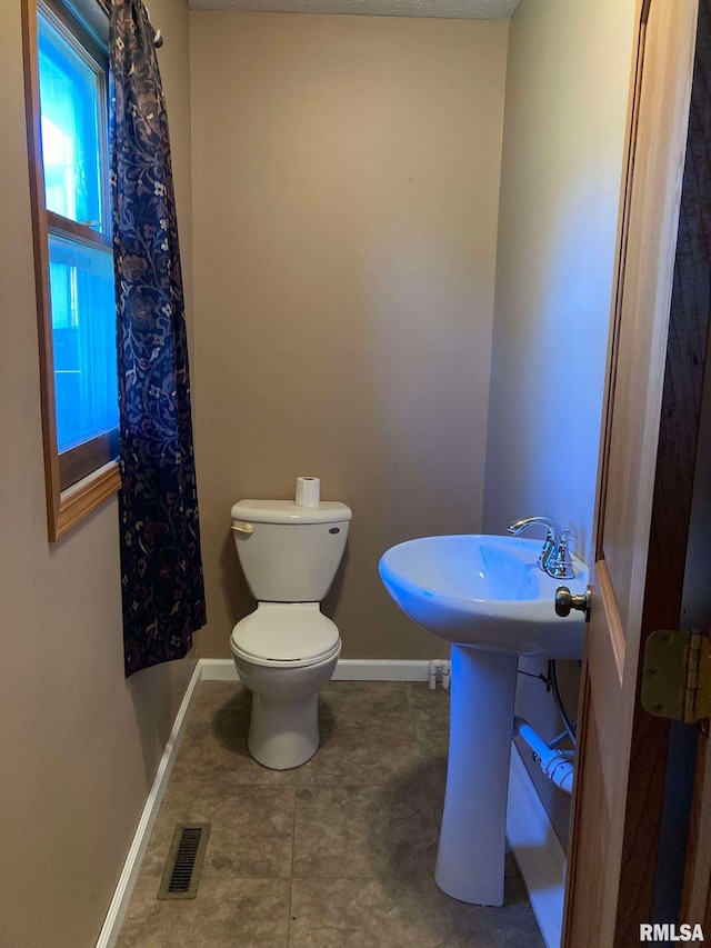 bathroom featuring toilet