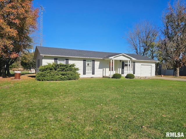 ranch-style house featuring a garage, a front lawn, and covered porch