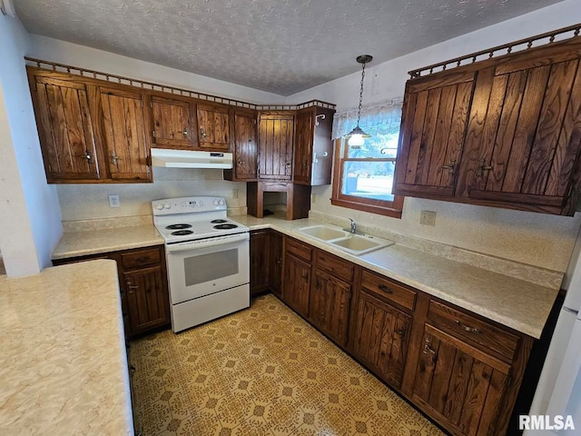 kitchen with electric stove, a textured ceiling, dark brown cabinets, pendant lighting, and sink