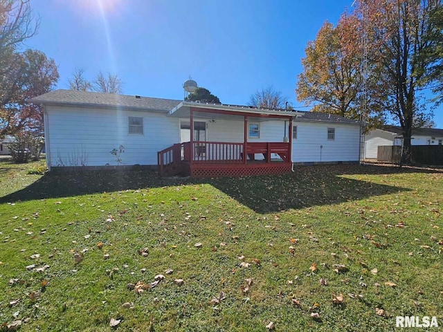 rear view of house with a yard