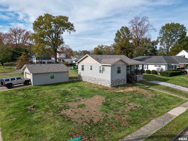 view of side of property with a garage, an outbuilding, and a yard